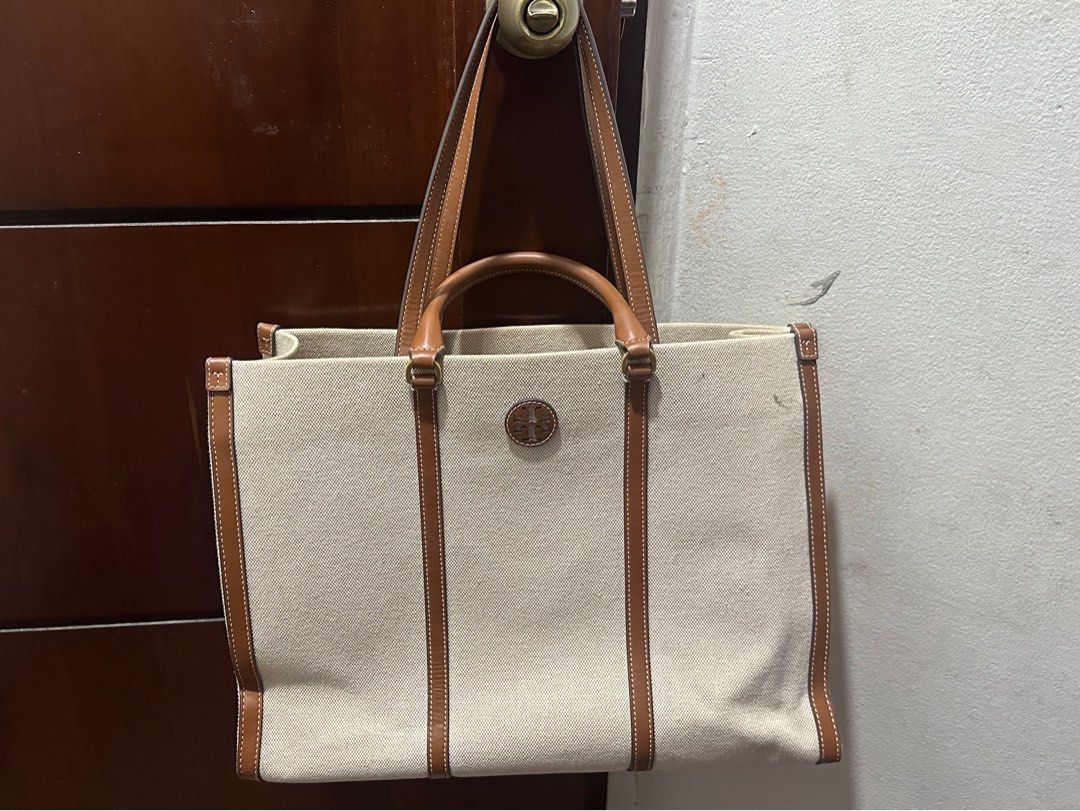 Authentic Tory Burch Blake Canvas Tote bag (Category: Luxury Bags & Wallets) located in Pasig City. Submitted by marikondolifeph (Listing ID 1280242545, Image 1). Description: Authentic Canada bought Color is Natural/Classic Cuoio Gold tone hardware Can be worn 2 ways I still have the paper bag, plastic and cartons included with this Like Lv on the go shape and size Canvas material Leather trim Interior open compartment 1 interior zip compartment