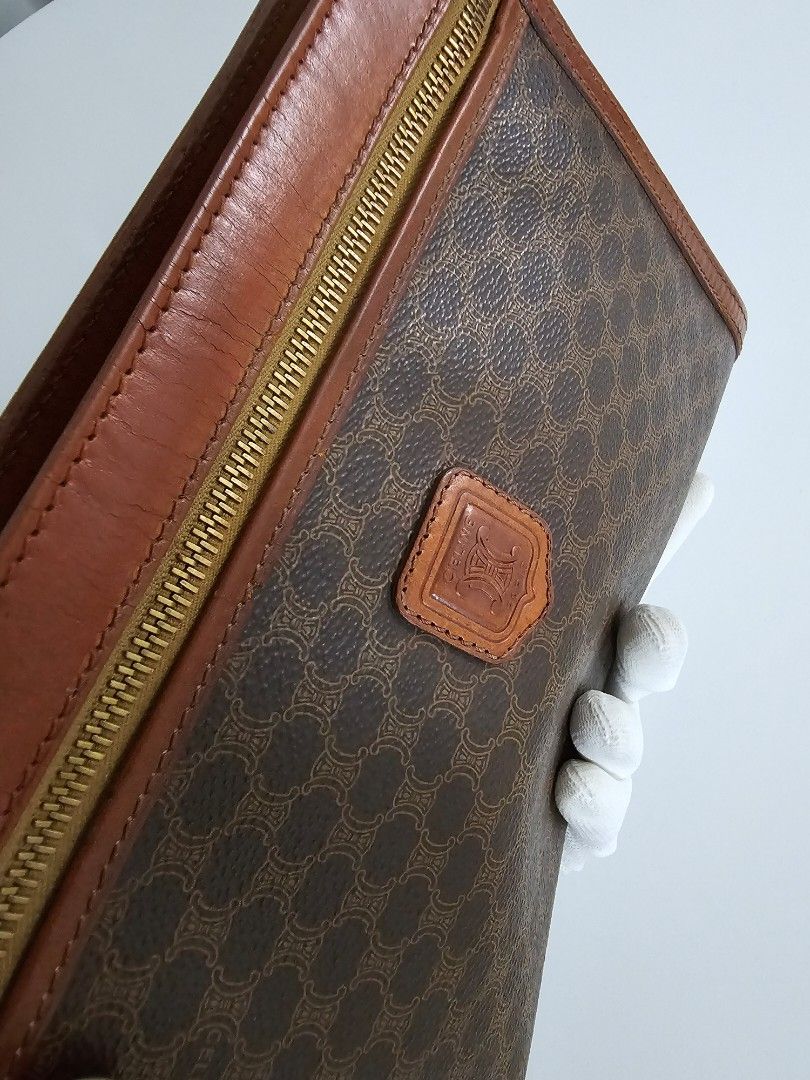 🧡Celine Macadam Brown Vintage Clutch (Category: Luxury Bags & Wallets) located in Las Pinas. Submitted by mybagsfromthepast (Listing ID 1280027013, Image 3). Description: 100% Original Celine Macadam Brown Vintage Clutch Unisex Clutch with wrist strap The perfect accessory to use to elevate your look. Brown PVC coated canvas with brown leather trim and brown leather handle. Top zipper closure with 1 interior zipper pocket. Very good preloved con