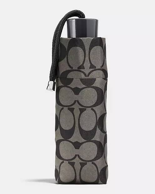 Coach Mini Umbrella (Category: Umbrellas) located in Manila. Submitted by shopaholic_gurl (Listing ID 1280193535, Image 2). Description: New with tags Original coach item from US Durable Nylon Fabric: Made from a lightweight yet durable nylon material for long-lasting use. Compact Size: With a round shape and one size, this mini umbrella is easy to carry and store. Signature Style: Features a stylish design with Coach’s iconic logo and Kaffe Fass