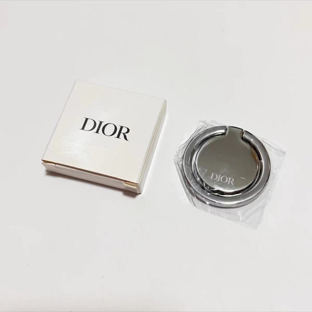 DIOR Silver Phone Holder✨ VIP Gift 🤍 (Category: Luxury Accessories) located in Cainta. Submitted by chambieee (Listing ID 1280095280, Image 1). Description: with original box authentic complimentary gift from DIOR .