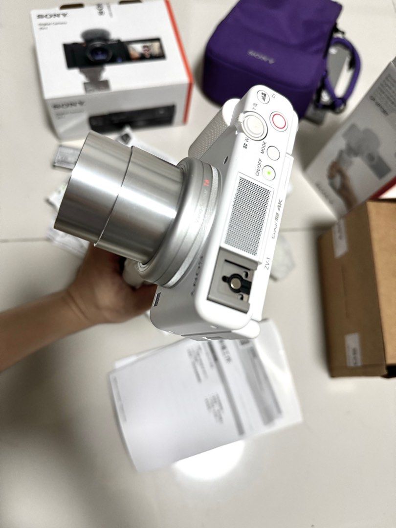 SONY WHITE ZV1 BUNDLE (barely used) (Category: Cameras) located in Manila. Submitted by msaudreybauza (Listing ID 1280059498, Image 3). Description: RFS : DECLUTTERING inclusions: ZV1 unit wireless sony grip GP-VPT2BT original sony battery 2 extra batteries battery charger adapter battery and sd card case Limited edition sony ZV1 Violet bag Complete manual Box and paperwork originall receipt 2 mountable deadcats.
