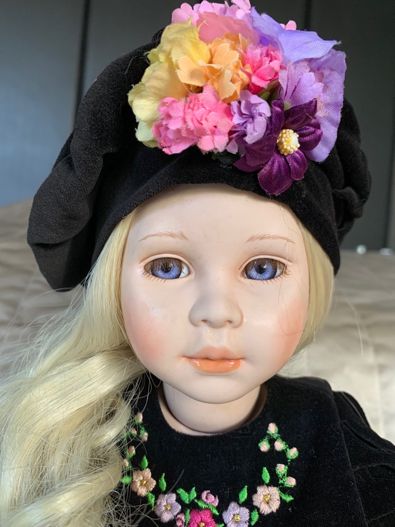 This is a limited edition vintage porcelain doll by Pauline’s