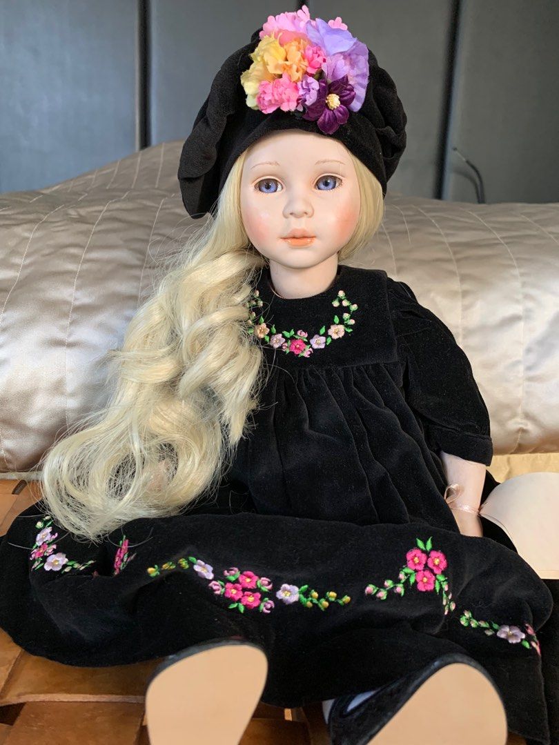 This is a limited edition vintage porcelain doll by Pauline’s