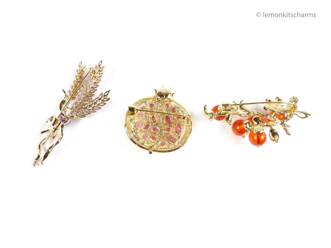 Gold brooch price outlet