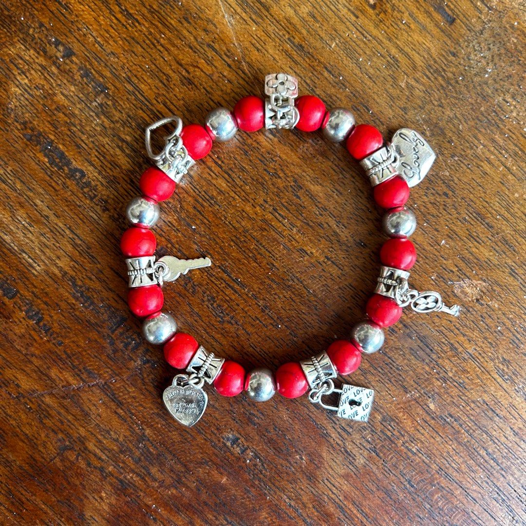 Red charm bracelet hotsell