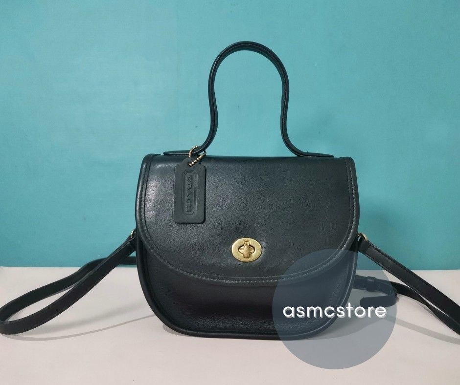 Coach Vintage BellaCourt in Black (Category: Luxury Bags & Wallets) located in Marikina City. Submitted by asmcstore (Listing ID 1280781334, Image 2). Description: Coach Vintage BellaCourt in Black Made in the United States August 1994 **LADYBUG CHARM NOT INCLUDED** **These are VINTAGE/PRELOVED bags signs of usage might be present** **Bags are cleaned and conditioned**.