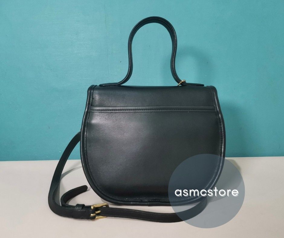 Coach Vintage BellaCourt in Black (Category: Luxury Bags & Wallets) located in Marikina City. Submitted by asmcstore (Listing ID 1280781334, Image 3). Description: Coach Vintage BellaCourt in Black Made in the United States August 1994 **LADYBUG CHARM NOT INCLUDED** **These are VINTAGE/PRELOVED bags signs of usage might be present** **Bags are cleaned and conditioned**.
