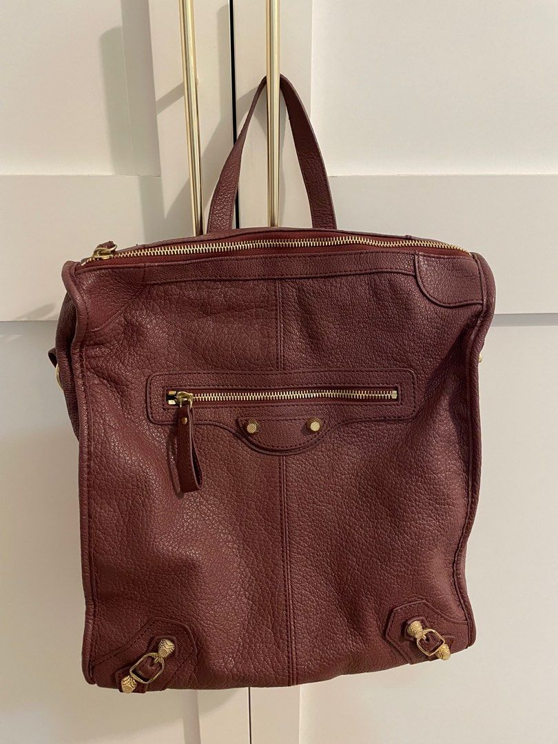 Maroon Backpack (Category: Backpacks) located in Singapore. Submitted by adelyn.kong (Listing ID 1280782863, Image 1). Description: Full leather haversack, lightly used for sale.