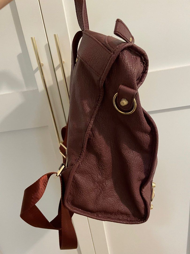 Maroon Backpack (Category: Backpacks) located in Singapore. Submitted by adelyn.kong (Listing ID 1280782863, Image 3). Description: Full leather haversack, lightly used for sale.