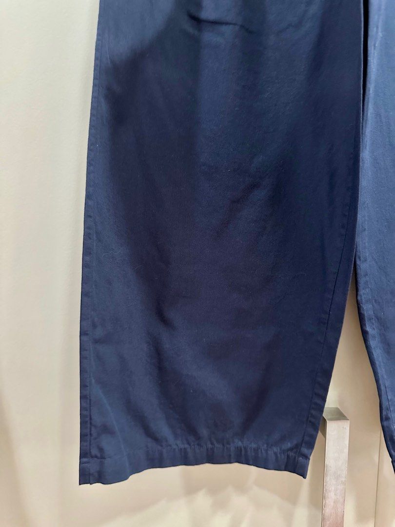 Navy blue Mango pleated trousers (Category: Other Bottoms) located in Pasig City. Submitted by Bbbb123 (Listing ID 1280683038, Image 3). Description: Comes with extra button replacement US4 fits 25-26” waistline.