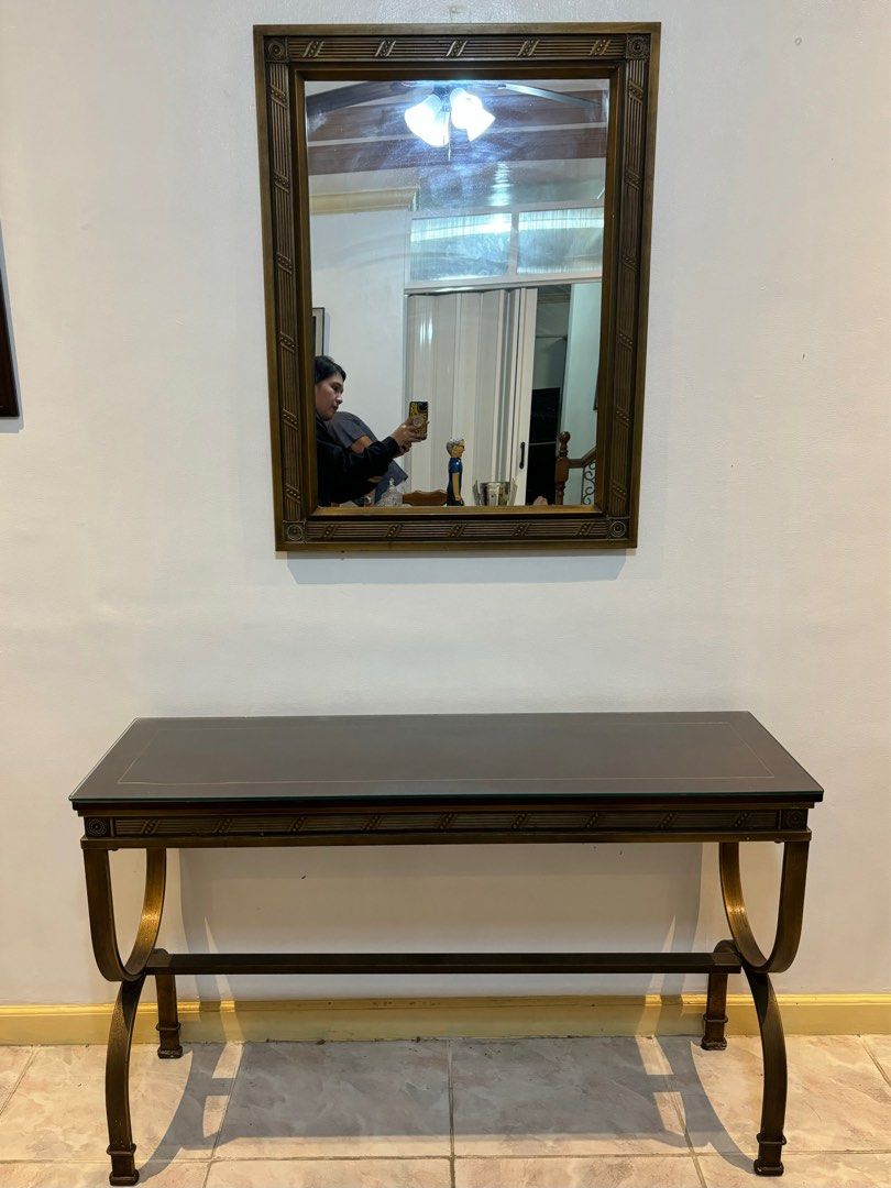 Neoclassical style brass console table with matching mirror (Category: Other Home Furniture) located in Marikina City. Submitted by micharon (Listing ID 1280728075, Image 1). Description: Made of brass and wood with glass top Durable This has been used for more than a decade. Please expect signs of use L 122cm W 38cm MOP BPI or Gcash only Pick up via Lalamove or transportify L300 📍Santolan, Pasig City (near LRT 2 Santolan Station).