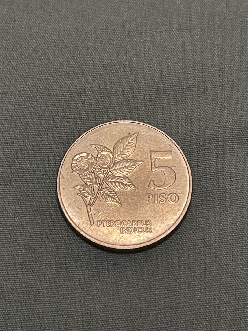 5 piso 1991 error coin (Category: Currency) located in Valenzuela. Submitted by eternallyblessed587 (Listing ID 1276027981, Image 2). Description: This 1991 Philippine 5-peso coin in very good condition has very noticeable obverse errors with 3 almost identical indented markings right in the mid jawline. .