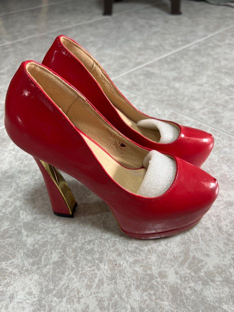 Red high clearance heel pumps