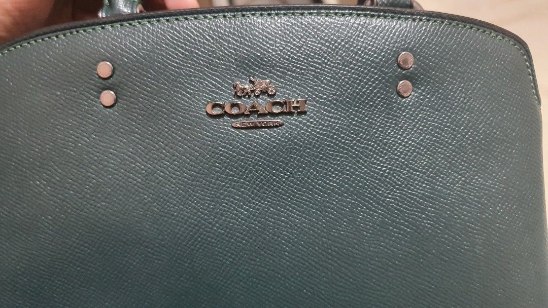 Coach Bag (Category: Luxury Bags & Wallets) located in Quezon City. Submitted by loveprelovedshop (Listing ID 1280873664, Image 3). Description: bought in Canada almost new with dustbag only with strap open for layaway (pm me for terms) can do meet up to check authenticity of bag.