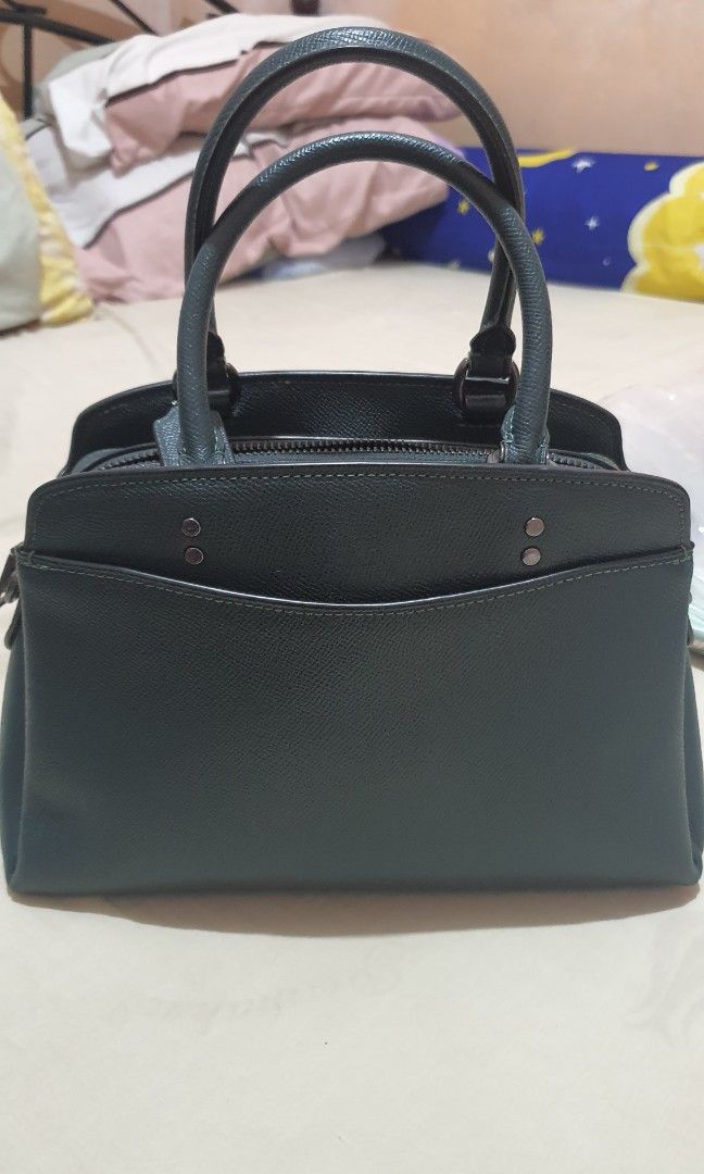 Coach Bag (Category: Luxury Bags & Wallets) located in Quezon City. Submitted by loveprelovedshop (Listing ID 1280873664, Image 2). Description: bought in Canada almost new with dustbag only with strap open for layaway (pm me for terms) can do meet up to check authenticity of bag.