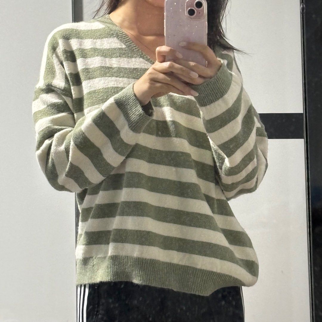 White and top green sweater