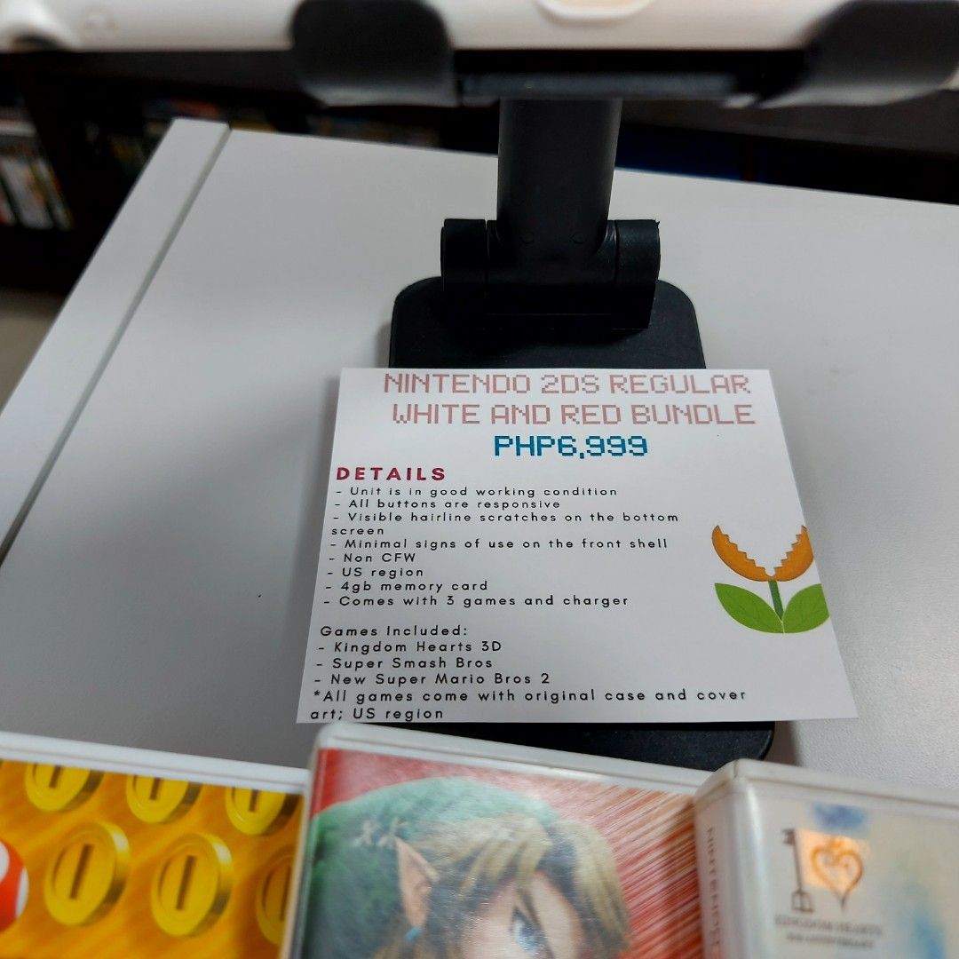 Nintendo 2DS Regular White and Red Bundle (Category: Nintendo) located in Manila. Submitted by watchesvideogamestoys (Listing ID 1280846864, Image 2). Description: 🎊FOR SALE🎊 🎮Nintendo 2DS Regular White and Red Bundle 🎮PhP6,999 📋Item Details: ✅️Unit is in good working condition ✅️All buttons are responsive ✅️Visible hairline scratches on the bottom screen ✅️Minimal signs of use on the front shell ✅️Non CFW ✅️US region ✅️4gb memory card ✅️Com