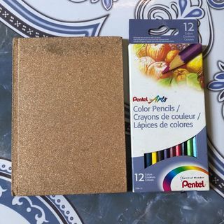 Pentel color pencils and blank notebook