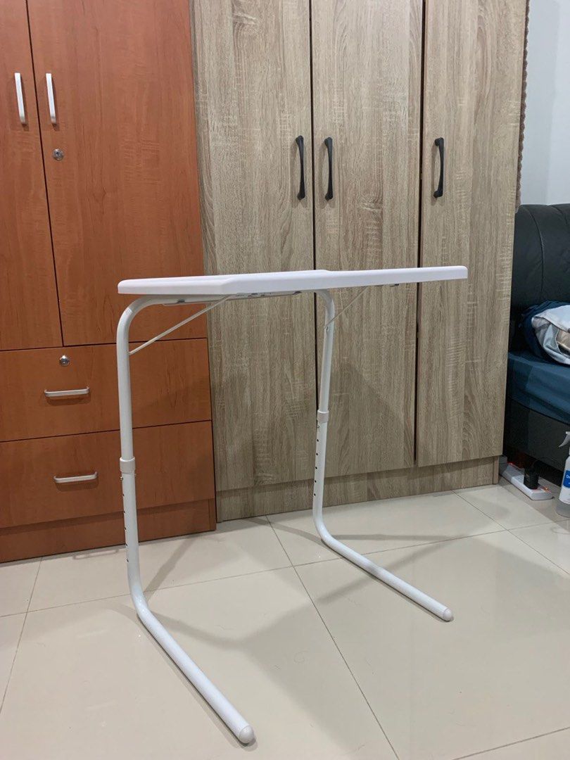 Side Table (Category: Tables & Sets) located in Singapore. Submitted by leiron25 (Listing ID 1280863863, Image 2). Description: Given to me as a gift, use 1 time to test. Folds & stacks for easy storage 6 different height adustments Comes with a box .