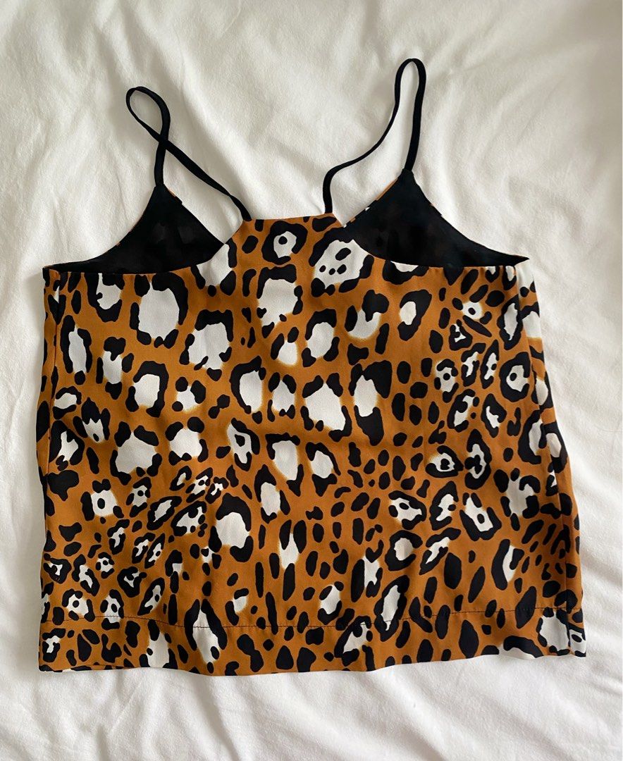 Topshop Leopard Print Racer Back XXS (Category: Sleeveless) located in Makati City. Submitted by style.cents (Listing ID 1280787525, Image 2). Description: Topshop Leopard Print Racer Back Size: Petite, XXS In good condition .