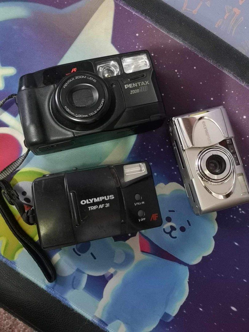 35mm FILM CAMERA BUNDLE (Category: Cameras) located in Caloocan City. Submitted by cjandmama (Listing ID 1281115485, Image 2). Description: All units untested / Sold as is Sold as bundle (take all) Good for parts and display Petri 7s Yashica mimy Minolta hi-matic Olympus trip AF31 Pentax Zoom 90 Olympus Mju II RFS: decluttering!.