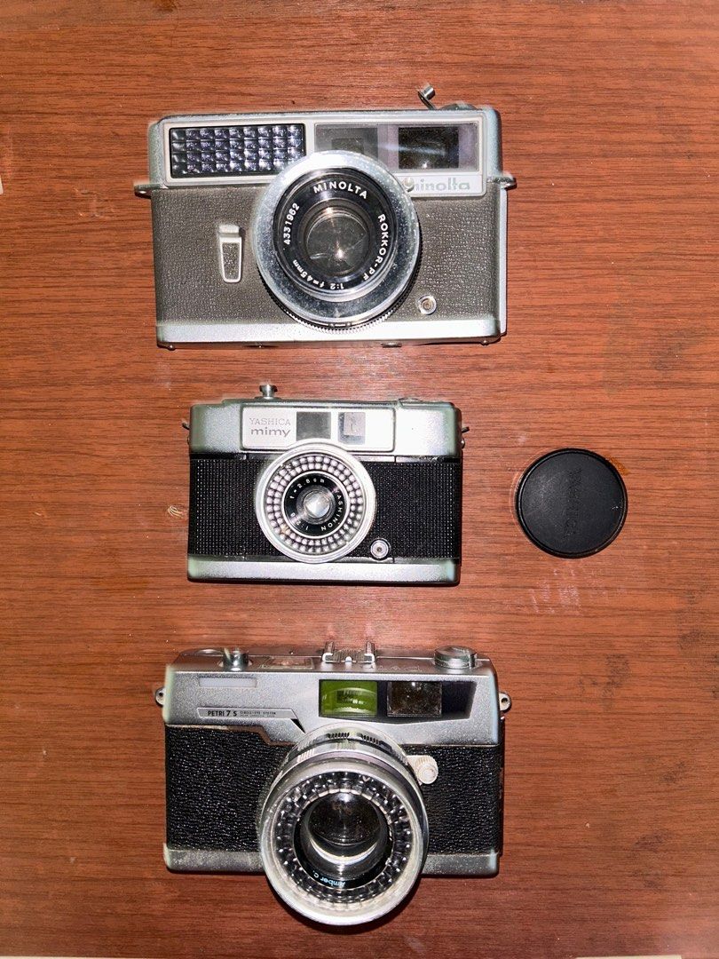 35mm FILM CAMERA BUNDLE (Category: Cameras) located in Caloocan City. Submitted by cjandmama (Listing ID 1281115485, Image 1). Description: All units untested / Sold as is Sold as bundle (take all) Good for parts and display Petri 7s Yashica mimy Minolta hi-matic Olympus trip AF31 Pentax Zoom 90 Olympus Mju II RFS: decluttering!.