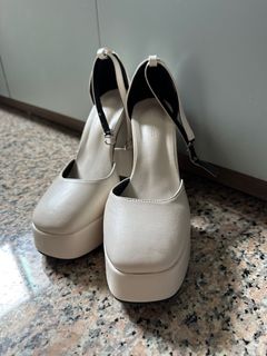 All white platform store heels
