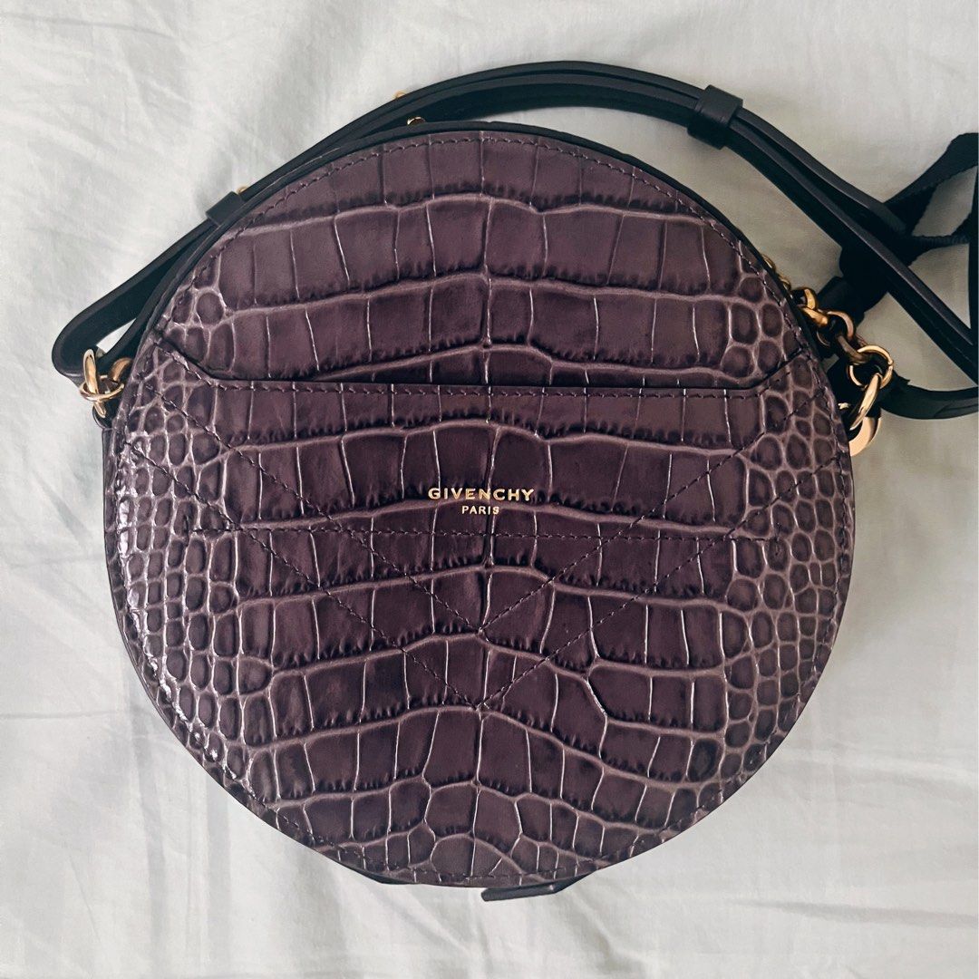 Givenchy Eden Round Crossbody Bag - Authentic (Category: Cross-body Bags) located in Mandaluyong City. Submitted by random.objects (Listing ID 1281028791, Image 1). Description: Authentic Givenchy Eden Crossbody Bag - Gray - 💯authentic - Gray leather in embossed croc texture - Adjustable shoulder strap - Gold tone chain hand strap - 18cm / 7” diameter - Front pocket and inside pocket - Red leather lining - Comes with Givenchy dust bag - MOP: GCa