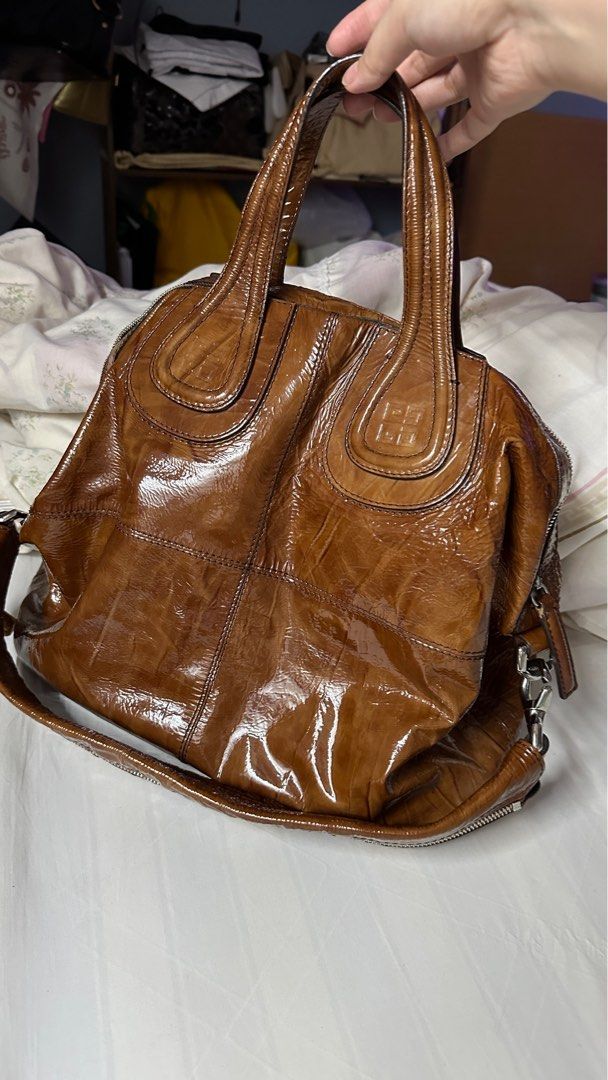 Nightingale medium Patent (Category: Luxury Bags & Wallets) located in Makati City. Submitted by cheekypinkie (Listing ID 1281208277, Image 1). Description: Givenchy Nightingale Medium size Patent leather material Very good condition with no notable flaws on the exterior Stain on the interior Comes with a detachable strap Comes with cards as well Viewing in Makati.