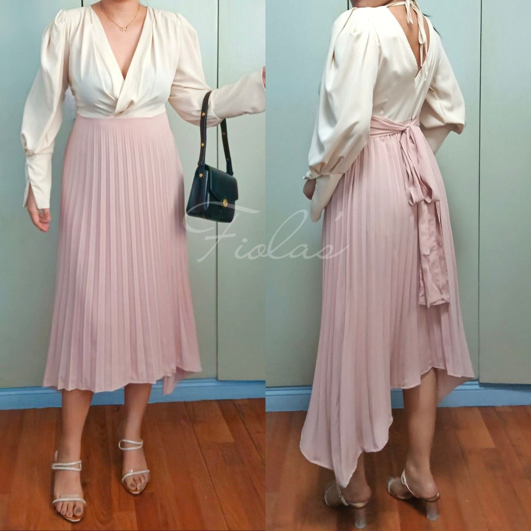 Puff Sleeves Pleated Midi Dress (Category: Dresses) located in Cainta. Submitted by fiolas26 (Listing ID 1281129075, Image 1). Description: Puff Sleeves Pleated Midi Dress BrandNew High Quality Medium to Large Chiffon Silk Fabric Color - Nude Beige, Blush Pink With Tie Very Rare Dress ❤️ Perfect for casual, ootd and more.. Model Height : 5'5 Model Body Frame : Medium.