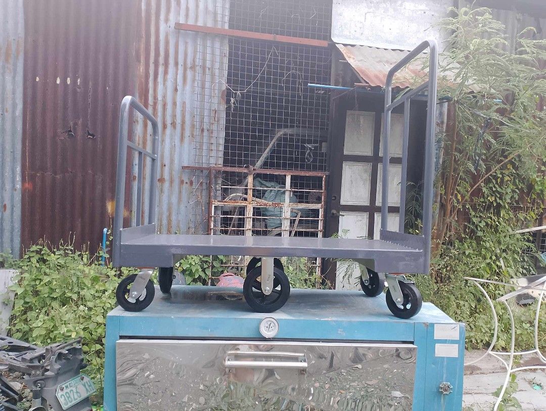 PUSHCART AND TROLLEY (Category: Construction Tools & Equipment) located in San Pedro. Submitted by draftingtablemaker (Listing ID 1281146878, Image 1). Description: PUSHCART/ Trolley –Heavy Duty MAX 400KG Capacity Dimensions: 3ft height handle from baseplate 2ft Depth x 4ft Width Ms-checkered plate flatbed 2mm Equipped with 2pcs Swivel Front wheel 6inches 2pcs Swivel Back wheel 6inches with lock and 2pcs 8inches center for easy maneuvering. PM us
