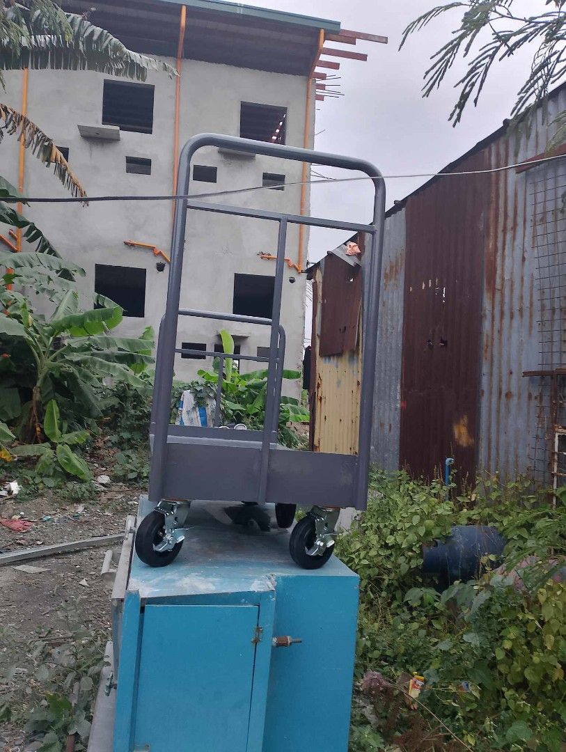 PUSHCART AND TROLLEY (Category: Construction Tools & Equipment) located in San Pedro. Submitted by draftingtablemaker (Listing ID 1281146878, Image 3). Description: PUSHCART/ Trolley –Heavy Duty MAX 400KG Capacity Dimensions: 3ft height handle from baseplate 2ft Depth x 4ft Width Ms-checkered plate flatbed 2mm Equipped with 2pcs Swivel Front wheel 6inches 2pcs Swivel Back wheel 6inches with lock and 2pcs 8inches center for easy maneuvering. PM us