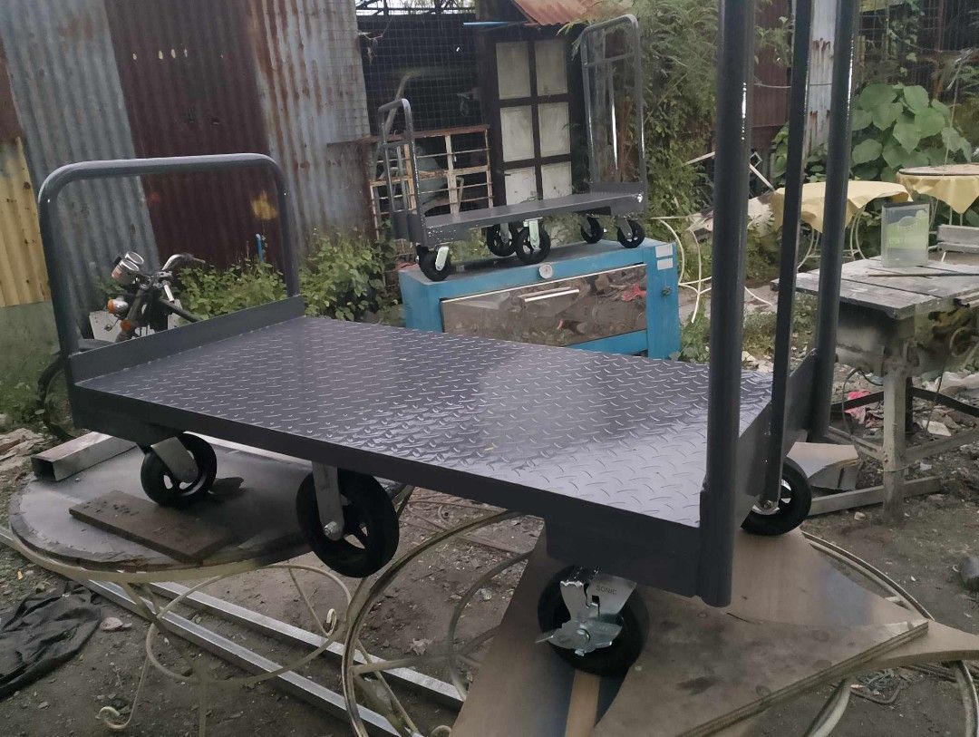 PUSHCART AND TROLLEY (Category: Construction Tools & Equipment) located in San Pedro. Submitted by draftingtablemaker (Listing ID 1281146878, Image 2). Description: PUSHCART/ Trolley –Heavy Duty MAX 400KG Capacity Dimensions: 3ft height handle from baseplate 2ft Depth x 4ft Width Ms-checkered plate flatbed 2mm Equipped with 2pcs Swivel Front wheel 6inches 2pcs Swivel Back wheel 6inches with lock and 2pcs 8inches center for easy maneuvering. PM us