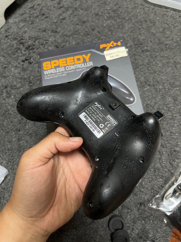 PXN Wireless Controller (Category: Others) located in Subang Jaya. Submitted by didiluke (Listing ID 1281095917, Image 3). Description: Fully functioning. I have tested it. Can connect with iphone, ipad, or whatever apple device you have. Item tkde defect, kecuali bahagian belakang controller. Body belakang controller getah mengelupas. Bought it from macstudio few years back. Reason to sell: I have too many controller in this lifetime. Hahaha..