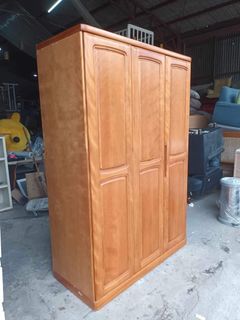Wooden 3-door closet   51L x 23W x 77H inches Solid wood doors In good condition Code akc 659