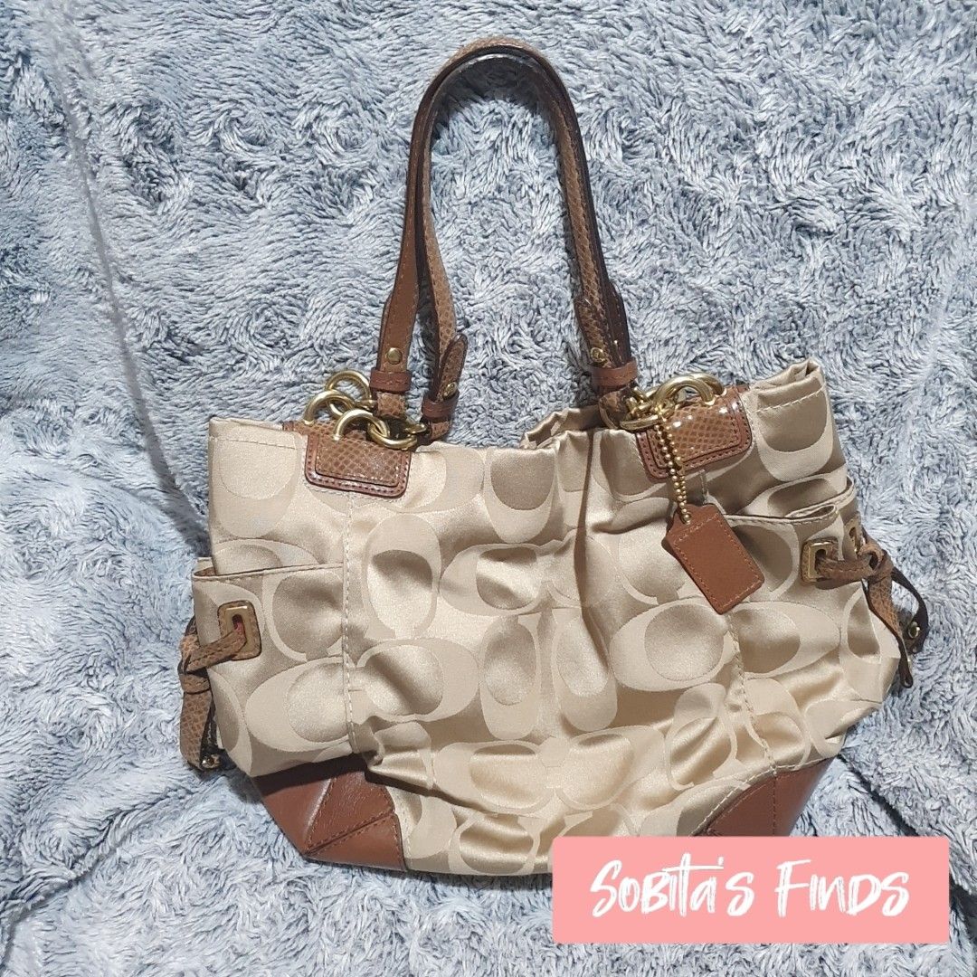 Coach bag with side discount pockets