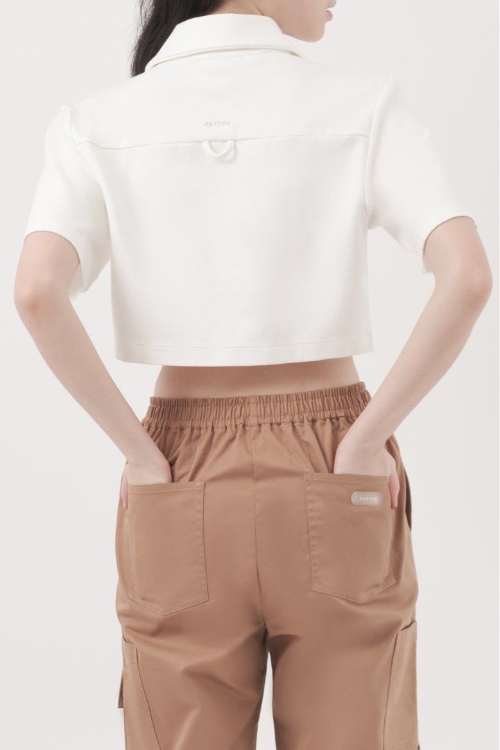 Patton Zip Cropped Polo in White (XS) (Category: Shirts) located in Quezon City. Submitted by nmdeclutters (Listing ID 1281283012, Image 3). Description: Website description: A loose-fit, short sleeve top with a cropped length, classic collar, front zip fastening and an embroidered logo. Thick, high quality material Retails for ₱4095 Also selling my same top in black in S (check previous listing) RFS: I don’t super love the fit on me Will not ent