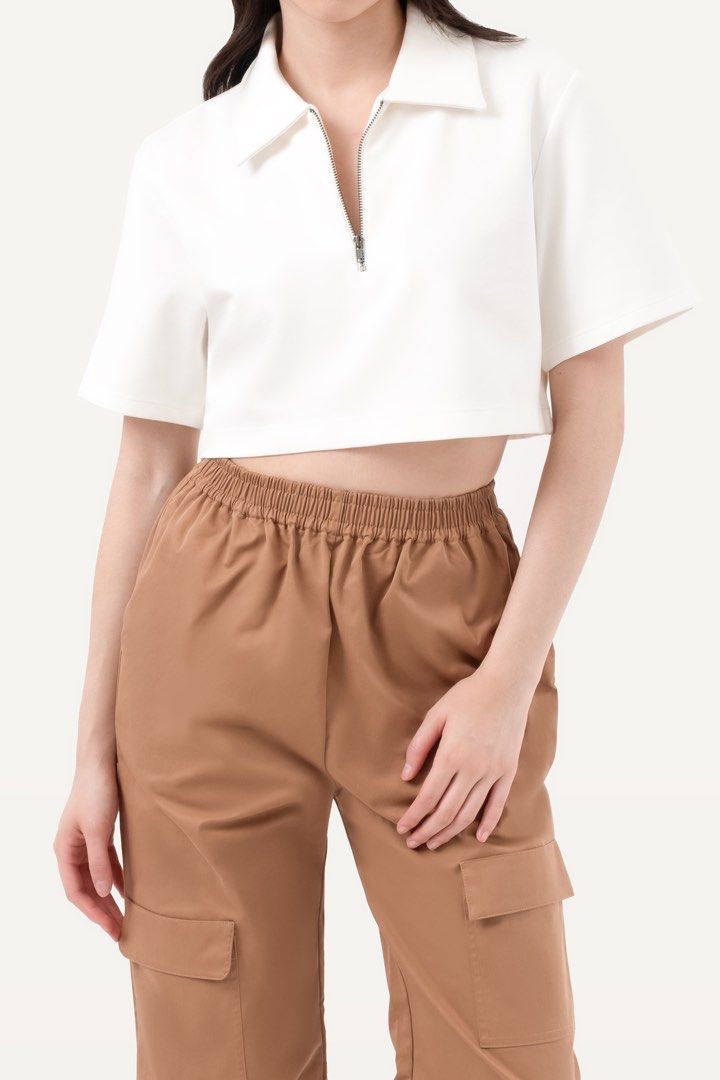 Patton Zip Cropped Polo in White (XS) (Category: Shirts) located in Quezon City. Submitted by nmdeclutters (Listing ID 1281283012, Image 1). Description: Website description: A loose-fit, short sleeve top with a cropped length, classic collar, front zip fastening and an embroidered logo. Thick, high quality material Retails for ₱4095 Also selling my same top in black in S (check previous listing) RFS: I don’t super love the fit on me Will not ent