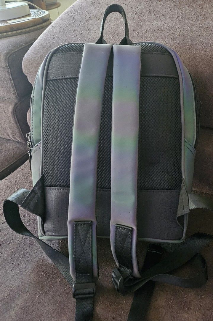 Backpack (Category: Backpacks) located in Singapore. Submitted by jennifer.larsson (Listing ID 1281452449, Image 3). Description: Like new no defects. zip all round smooth. colour: Basic Light Grey with lights reflect to multi colour. Size: 30x23 x 12cm.
