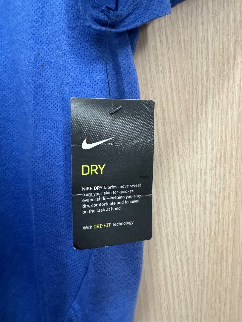 Authentic Nike Running Dri-Fit Shirt (Category: Activewear) located in Taguig. Submitted by jcs86 (Listing ID 1281711385, Image 3). Description: Brand new with tag. Issue: With stains from long storage ( please see photos). .