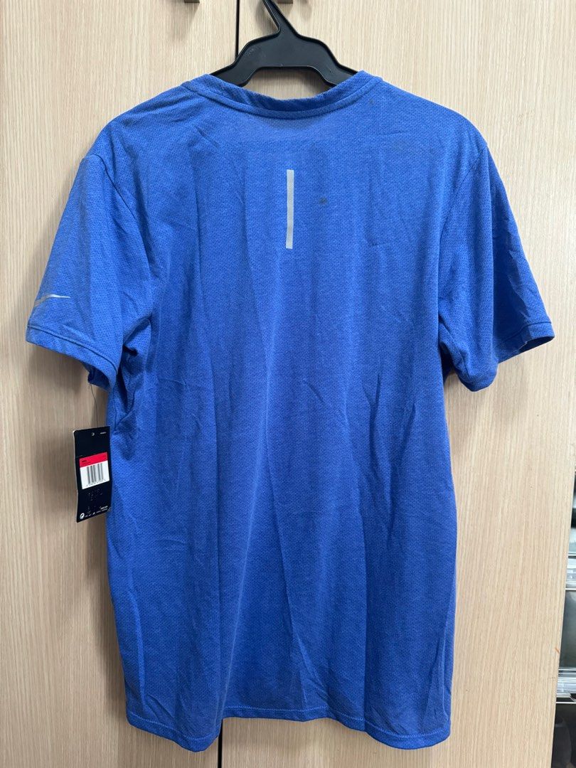 Authentic Nike Running Dri-Fit Shirt (Category: Activewear) located in Taguig. Submitted by jcs86 (Listing ID 1281711385, Image 2). Description: Brand new with tag. Issue: With stains from long storage ( please see photos). .