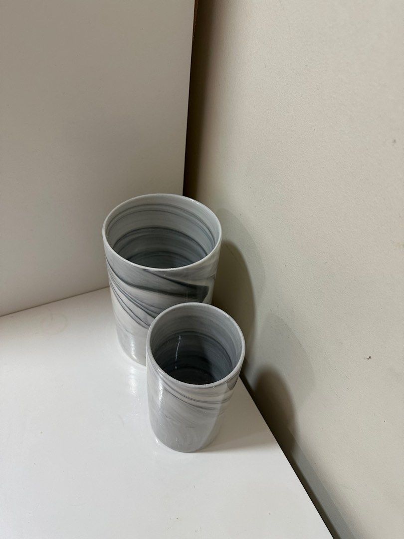 Marble vase / container (Category: Vases & Decorative Bowls) located in Cyberjaya. Submitted by syamil86 (Listing ID 1281649708, Image 2). Description: Item in super good condition Never used Measurements: Big: height 17cm, diameter 11cm Small: height 14cm, diameter 8cm.