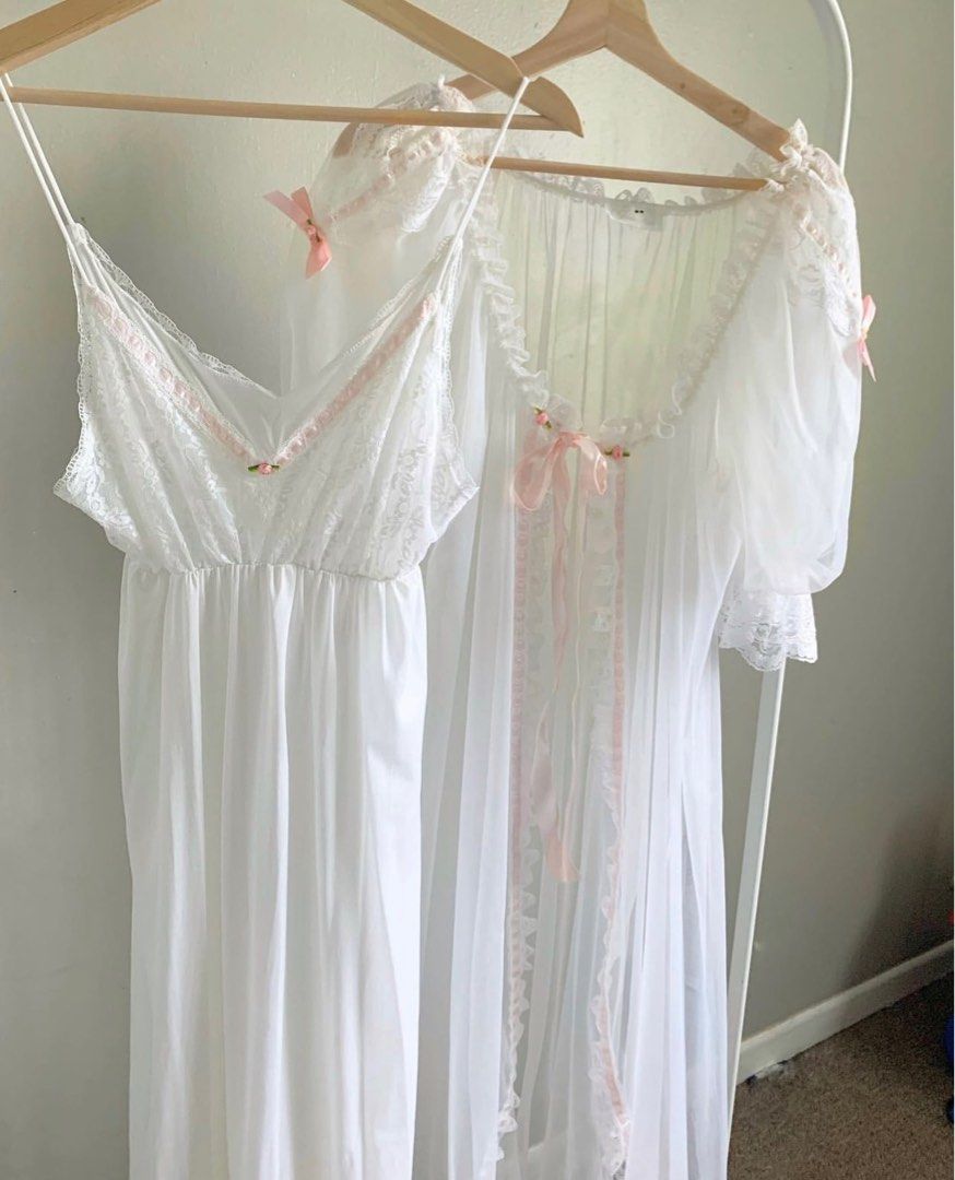 [SOLD] vintage lingerie set (Category: Undergarments & Loungewear) located in Urdaneta. Submitted by thriftsbyfelas (Listing ID 1281777951, Image 1). Description: - Mesh robe with pink ribbon on the sleeves and down the center of the robe. Puffy sleeves. - Tie in the front of the robe. - Long Slip. - The chest part is made of lace see through material and the body is a thin soft nylon. - Slightly see through - Sell online $100-$300 - Size: Medium
