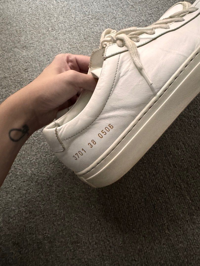 Woman by Common Projects Achilles Low (Category: Sneakers) located in Makati City. Submitted by nisayaptinchay (Listing ID 1281728855, Image 2). Description: Woman by Common Projects Achilles Low (White) Size: 38 Well Used with Wear & Tear (Please see photos for close ups) Just needs a little cleaning Bought from Lane Crawford HK Brand new costs P26,000 No more box and dustbags.
