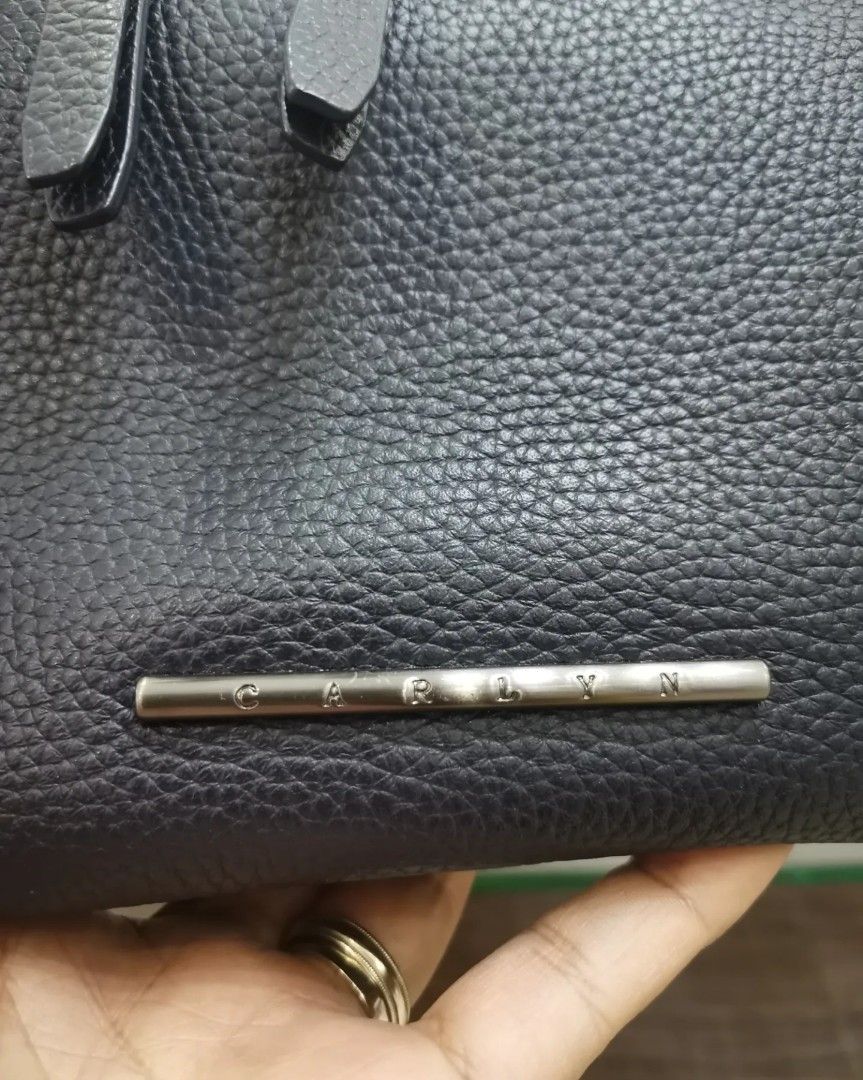 💯% Authentic Carlyn Real Leather Bag (Category: Luxury Bags & Wallets) located in Paranaque City. Submitted by luxehuntsmla.bymari (Listing ID 1281823927, Image 3). Description: 💯% Authentic Carlyn Two-way Bag with real snakeskin lining. ✅ Almost like new! ✅ Real snake leather trimmings/lining ✅ Light rubs on corners ✅ Clean inside and out ✅ No foul smell ✅ Actual color is dark blue ✅ Bag only.