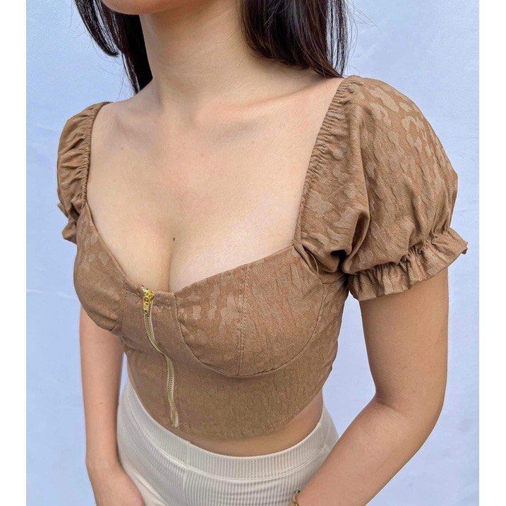 Candy Zipper Corset Puff Sleeve Crop Top (Category: Others Tops) located in Cavite. Submitted by prelovedbyZ (Listing ID 1281927143, Image 3). Description: Brand: Candy Color: Khaki (w leopard design) Size: Small Functional zipper Used once. Like new..