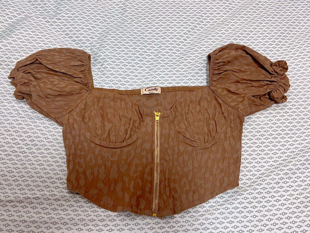 Candy Zipper Corset Puff Sleeve Crop Top (Category: Others Tops) located in Cavite. Submitted by prelovedbyZ (Listing ID 1281927143, Image 1). Description: Brand: Candy Color: Khaki (w leopard design) Size: Small Functional zipper Used once. Like new..