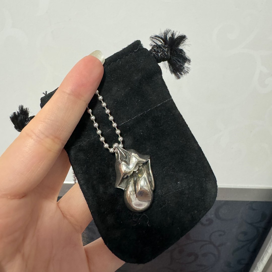 Chrome hearts rolling stones on sale necklace