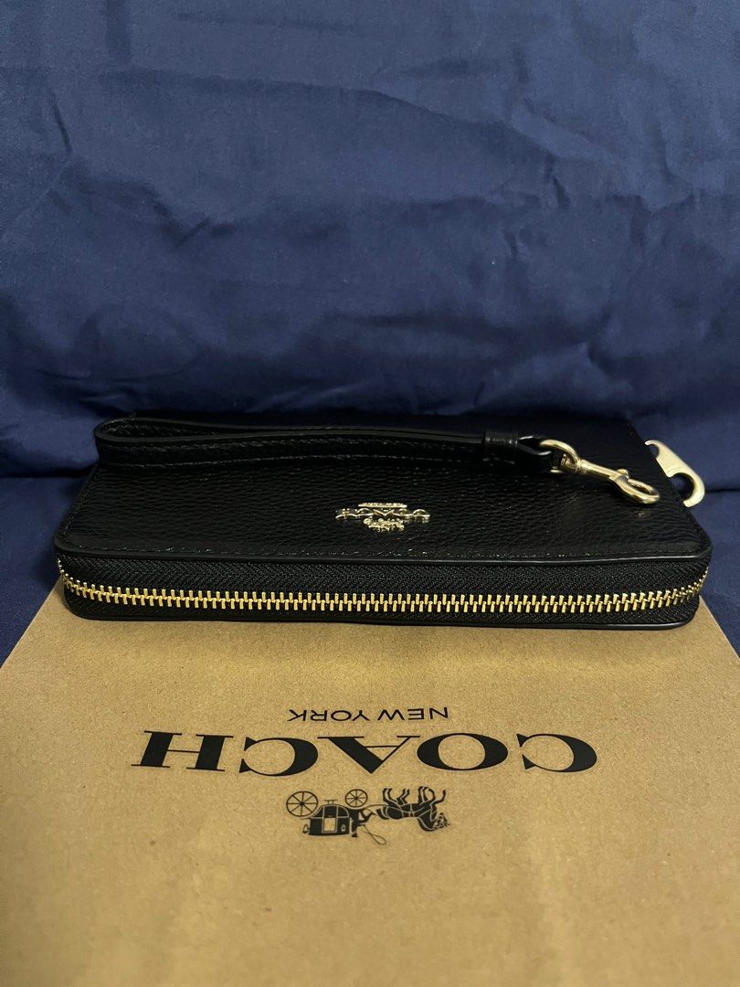 Coach Long Zip Around Wallet in Black (Category: Wallets & Card holders) located in Rizal. Submitted by pieces_mnl (Listing ID 1281981529, Image 2). Description: - Brand New - Color: Gold/Black - With Original Price Tag - With Gift Receipt for proof of authenticity - Included Coach Paper Bag Refined pebble leather 12 credit card slots Full-length bill compartments Inside zip coin pocket Zip-around closure Detachable wrist strap 7 1/2” (L) x 4” (H