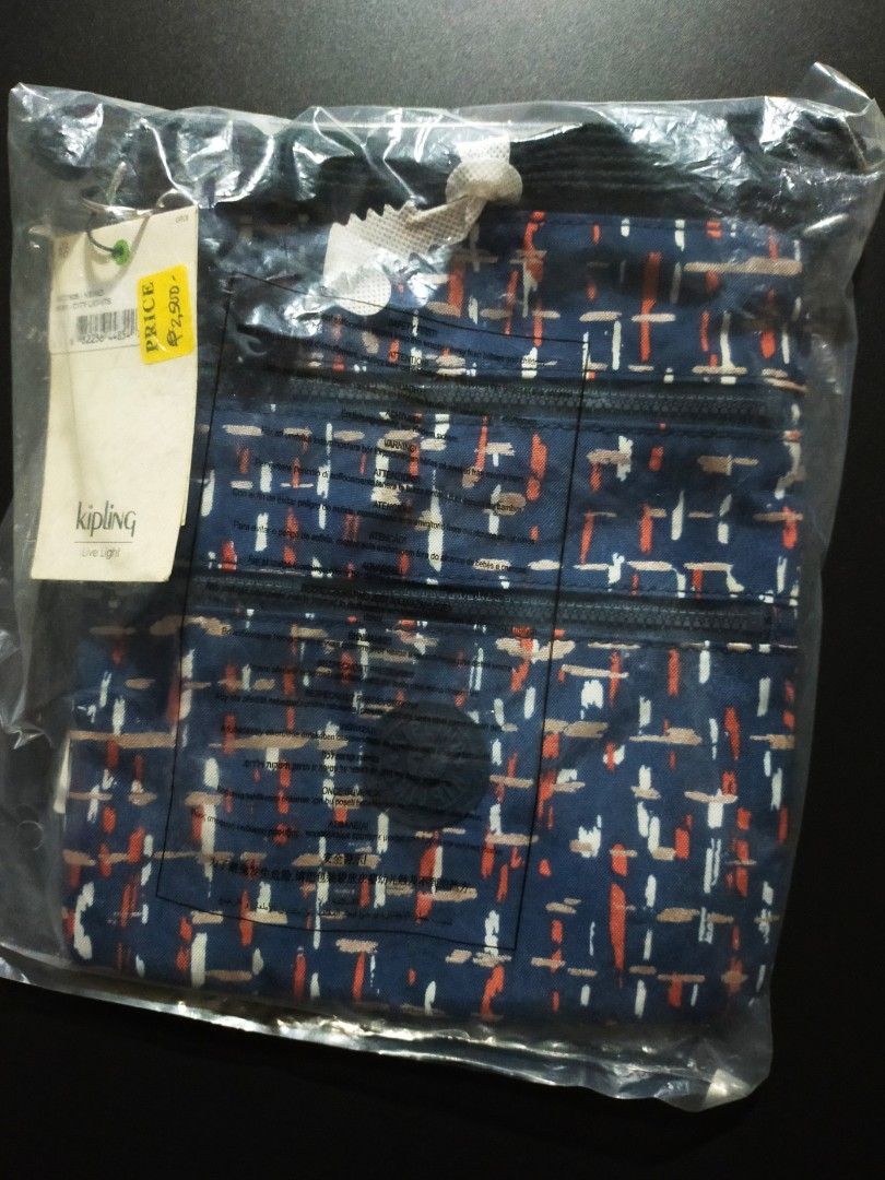 Kipling Keiko City Lights Navy Patterned Crossbody Bag (Category: Cross-body Bags) located in Tanza. Submitted by lessmess.ph (Listing ID 1281984522, Image 1). Description: Kipling Keiko City Lights Navy Patterned Crossbody Bag • Received as a gift but never used • Still in the original packaging, with tag and keychain • Has three zipper compartments • Approx. 8.5in x 9.5in MOP: GCash and Maya MOD: LBC or Lalamove.
